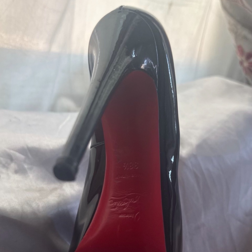 Red bottom louboutin shiny black